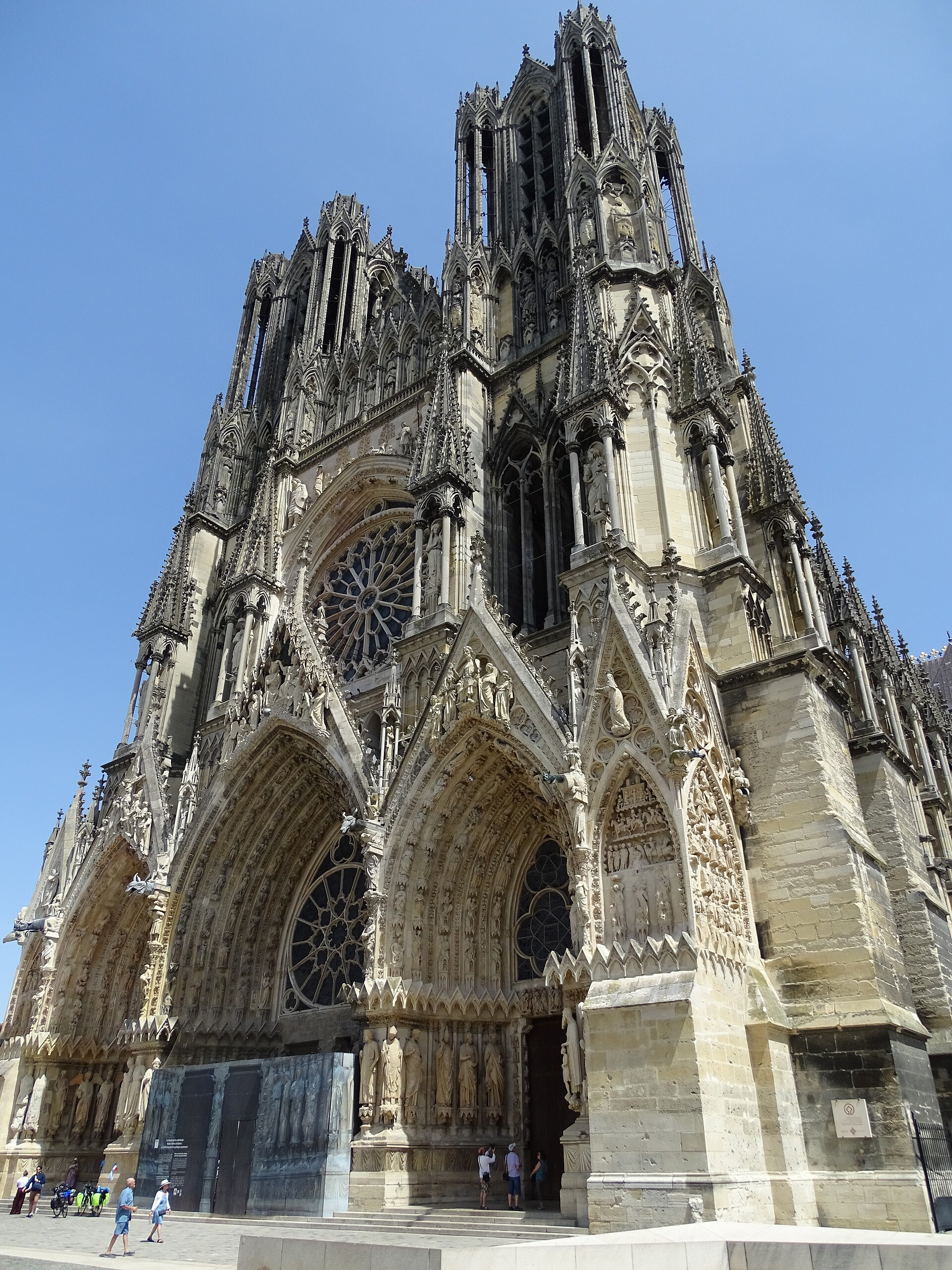 The richly decorated west façade of Reims Cathedral